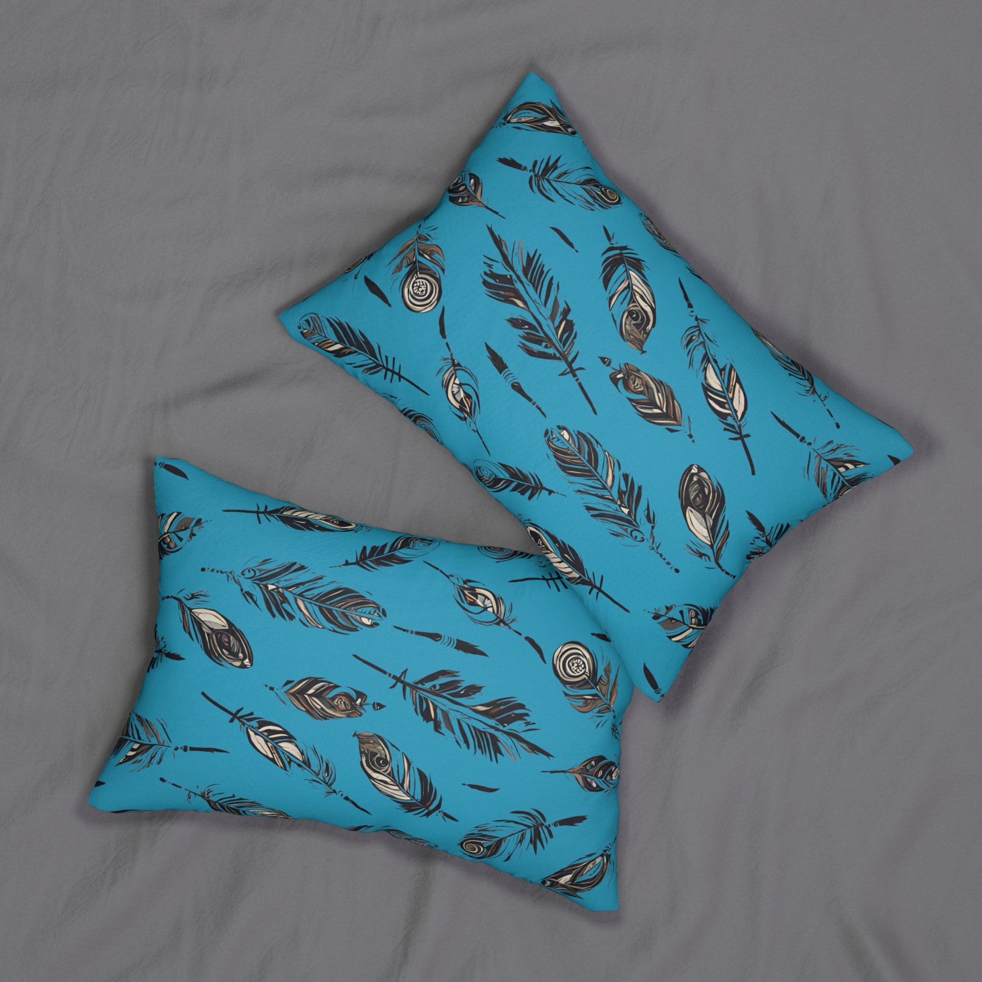 Inviting a Pair of Rectangular Native American Turquoise Feather-Design Pillows layed on grey bed sheet.